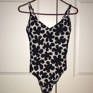 Black and white patterned bathing suit.